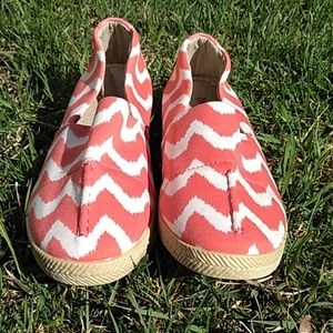 peach and white slip on shoes.